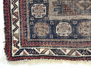 Ghostly but friendly old Baluch square middle bagface. I like the border. 19th c. 
2’7” x 2’10”                