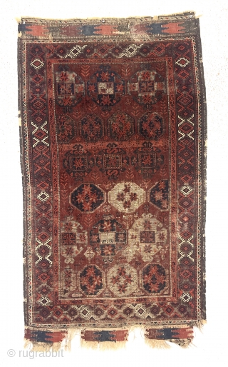 Older Baluch rug with an uncommon design. Overall intact but rough condition with heavily oxidized browns and wear as shown. All natural colors. Appears reasonably clean. An interesting example for study. Priced  ...