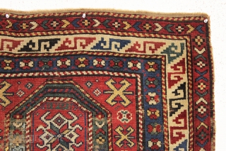 unusual and early small antique kazak prayer rug. dated 1271. "as found" condition with wear, end loss and crude flat stitch repair across center as shown. All natural colors. Rough but not  ...