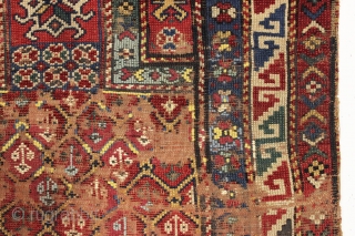 unusual and early small antique kazak prayer rug. dated 1271. "as found" condition with wear, end loss and crude flat stitch repair across center as shown. All natural colors. Rough but not  ...