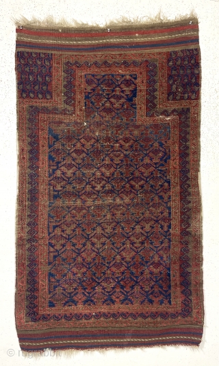 Antique blue ground Baluch prayer rug with shrub lattice. Unusual hand panel design with mini boteh. Nice original wide flat woven ends and original selvages. Overall fair condition for the age with  ...