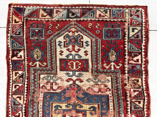 Antique STAR KAZAK. Sorry, no, but truly  an antique Caucasian rug with an iconic Star Kazak border. Cheerful and colorful with wear and scattered old repiling. 3’8” x 6’3”   