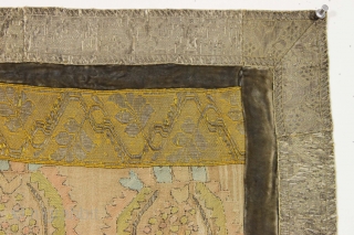 Small old something. Made up around an old central fragment, probably
anatolian, with added textile borders. Lots of metallic thread in the borders, a bit in the center. Cloth backing appears loose other  ...