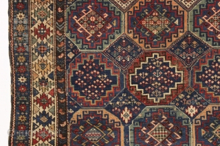 antique kuba rug with an unusually large variety of designs in the field. The overall effect is of great delicacy and i don't think one could fit in much more. Overall pretty  ...