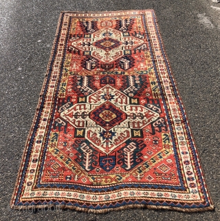 Antique Caucasian karrabagh rug, a type often described as “Kasim Ushak”. This reasonably early example has the characteristic medallions and serrated leaf motifs plus many interesting tribal decorations of humans and animals.  ...