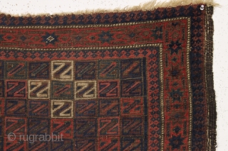 antique baluch rug. Something of an unusual design with all those z's. All good colors with some camel wool pile. "as found", very dirty with wear and old patch as shown and  ...