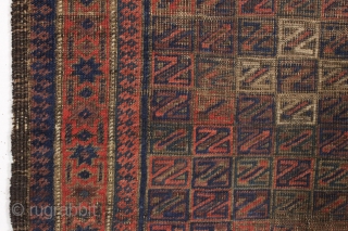 antique baluch rug. Something of an unusual design with all those z's. All good colors with some camel wool pile. "as found", very dirty with wear and old patch as shown and  ...