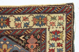 antique little east caucasian rug, probably best described as seichour, with an unusual variation of the bijov design. The light blue wing like medallions are hard to ignore. "as found", very dirty  ...