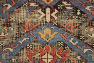 antique little east caucasian rug, probably best described as seichour, with an unusual variation of the bijov design. The light blue wing like medallions are hard to ignore. "as found", very dirty  ...