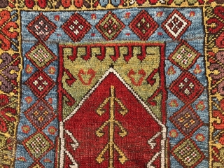 Antique Turkish village prayer rug. Simple, dramatic drawing. Good saturated natural colors including a rich tomato red, strong yellow, sky blues, lovely greens and a nice old aubergine. Overall low pile with  ...