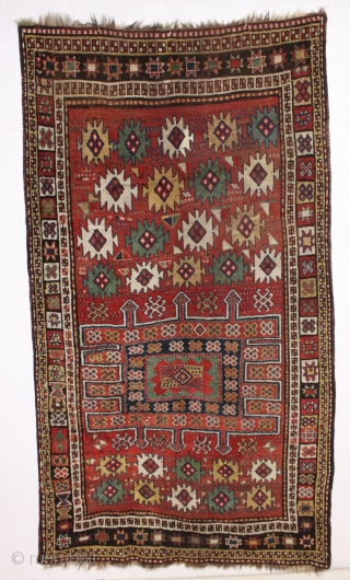 antique large kordi or quchan kurd rug with a strangely assymetric design. In good allover condition with much thick pile. All natural colors featuring a nice old green. A few small repairs,  ...