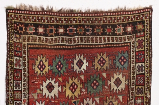 antique large kordi or quchan kurd rug with a strangely assymetric design. In good allover condition with much thick pile. All natural colors featuring a nice old green. A few small repairs,  ...