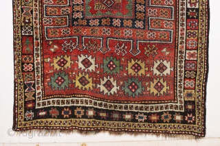 antique large kordi or quchan kurd rug with a strangely assymetric design. In good allover condition with much thick pile. All natural colors featuring a nice old green. A few small repairs,  ...