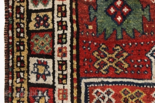 antique large kordi or quchan kurd rug with a strangely assymetric design. In good allover condition with much thick pile. All natural colors featuring a nice old green. A few small repairs,  ...