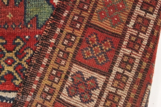 antique large kordi or quchan kurd rug with a strangely assymetric design. In good allover condition with much thick pile. All natural colors featuring a nice old green. A few small repairs,  ...