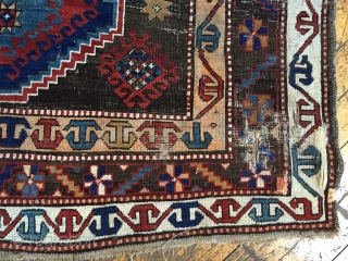 Business mans special. Antique Caucasian rug of some kind featuring a man wearing a tie. Kazak? Karrabaugh? Zakatala? Bold and compelling design with an unusual palette. Vibrant blues and reds along with  ...
