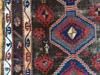 Business mans special. Antique Caucasian rug of some kind featuring a man wearing a tie. Kazak? Karrabaugh? Zakatala? Bold and compelling design with an unusual palette. Vibrant blues and reds along with  ...