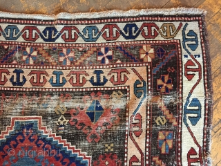 Business mans special. Antique Caucasian rug of some kind featuring a man wearing a tie. Kazak? Karrabaugh? Zakatala? Bold and compelling design with an unusual palette. Vibrant blues and reds along with  ...