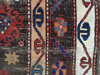 Business mans special. Antique Caucasian rug of some kind featuring a man wearing a tie. Kazak? Karrabaugh? Zakatala? Bold and compelling design with an unusual palette. Vibrant blues and reds along with  ...