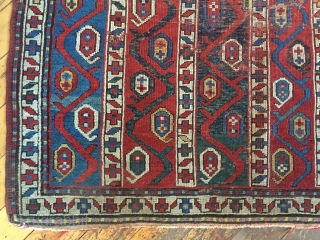 Antique kazak rug with an interesting striped design. Wear, damage and crude old repairs. Original colors all good. Rough but priced accordingly. Storage clean out continues. Late 19th c. 3'11" x 7'6" 
