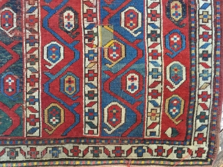 Antique kazak rug with an interesting striped design. Wear, damage and crude old repairs. Original colors all good. Rough but priced accordingly. Storage clean out continues. Late 19th c. 3'11" x 7'6" 