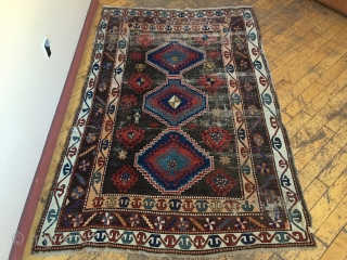 Business mans special. Antique Caucasian rug of some kind featuring a man wearing a tie. Kazak? Karrabaugh? Zakatala? Bold and compelling design with an unusual palette. Vibrant blues and reds along with  ...