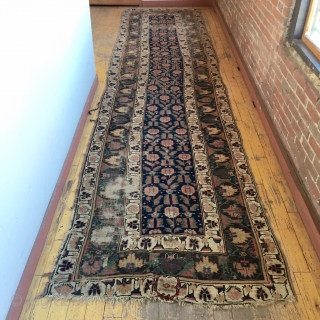 Early large northwest Persian rug. Eye catching archaic border. Excellent all natural colors featuting lovely greens and rich old purples. As found, areas of wear, slight edge roughness, crude patch. Restorable. Storage  ...