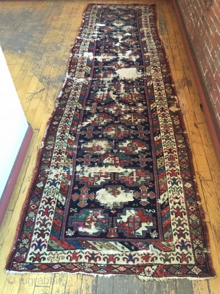 Antique tribal long rug, probably veramin, with terrific drawing featuring an attractive archaic border. All natural colors. Washed and clean. Otherwise as found with scattered heavy wear through out as shown. Storage  ...
