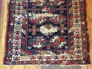 Antique tribal long rug, probably veramin, with terrific drawing featuring an attractive archaic border. All natural colors. Washed and clean. Otherwise as found with scattered heavy wear through out as shown. Storage  ...