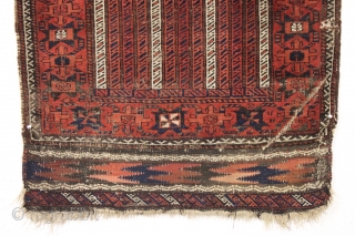 antique baluch rug with an interesting and unusual design. Another piece from a local Boston home. Charming cane design field and an attractive unusual border. All natural colors. In fair condition. Even  ...