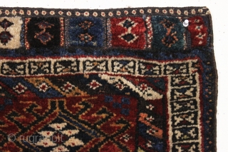 antique persian bagface, possibly baktiari. Charming little weaving featuring pile closure tabs. Full thick pile. All natural colors including a nice old purple. Reasonably clean. Good age, ca 1880. 20" x 21" 