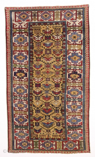 antique yellow ground caucasian gendge rug. Nicely drawn large tulip palmettes and an unusually colorful kufic border. Overall good condition with even medium pile. All natural colors including nice greens, light blues,  ...