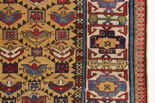 antique yellow ground caucasian gendge rug. Nicely drawn large tulip palmettes and an unusually colorful kufic border. Overall good condition with even medium pile. All natural colors including nice greens, light blues,  ...