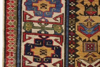 antique yellow ground caucasian gendge rug. Nicely drawn large tulip palmettes and an unusually colorful kufic border. Overall good condition with even medium pile. All natural colors including nice greens, light blues,  ...