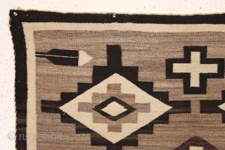 pretty little navajo rug with attractive feather design. local New England find. Good earthy natural colors with no dye run. Thin and floppy handle and clean. Reasonably good condition with one small  ...