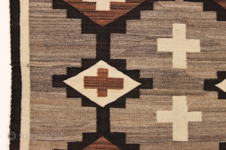 pretty little navajo rug with attractive feather design. local New England find. Good earthy natural colors with no dye run. Thin and floppy handle and clean. Reasonably good condition with one small  ...