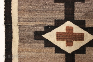 pretty little navajo rug with attractive feather design. local New England find. Good earthy natural colors with no dye run. Thin and floppy handle and clean. Reasonably good condition with one small  ...