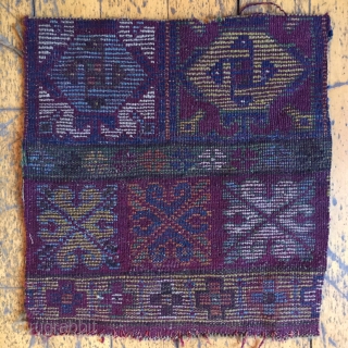 Mysterious little fragment of a rug found while cleaning out storage. Interesting color palette and whirling design elements. Dark purple wool wefts and natural brown wool warps. Good pile but very dirty.  ...
