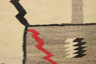 Older navajo rug with storm design. "as found", very dirty and with a good hole. Nice tight weave. No dye run. late 19th c. 3'6" x 5'7"      