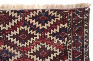 antique nascent or fragmentary turkoman asmalyk with an unusual border. Appears to have all natural dyes and an interesting and unusual palette. Various old small crude repairs and of course the big  ...