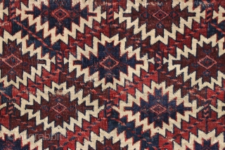 antique nascent or fragmentary turkoman asmalyk with an unusual border. Appears to have all natural dyes and an interesting and unusual palette. Various old small crude repairs and of course the big  ...