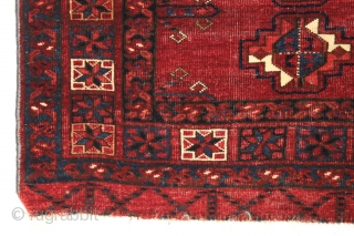 Antique large ersari chuval with spacious drawing and an eye catching border. A grand old chuval with an unusual corrosive red ground and brilliant light blues. All natural colors with multiple reds.  ...