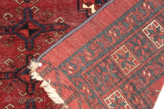 Antique large ersari chuval with spacious drawing and an eye catching border. A grand old chuval with an unusual corrosive red ground and brilliant light blues. All natural colors with multiple reds.  ...