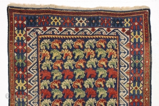 Antique seichour kuba rug with a classic carnation design field paired with an unusual and colorful border. Allover good medium height pile. All good natural colors featuring nice old greens. I see  ...