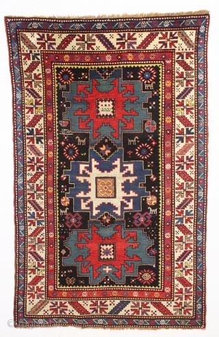 antique kazak rug in excellent condition with inscribed date 1305 (1887). Bold lesghi star design with charming animals and what looks to be a full blown fireworks display. All natural colors featuring  ...