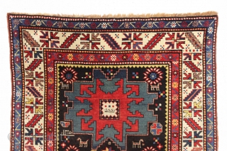 antique kazak rug in excellent condition with inscribed date 1305 (1887). Bold lesghi star design with charming animals and what looks to be a full blown fireworks display. All natural colors featuring  ...