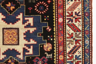 antique kazak rug in excellent condition with inscribed date 1305 (1887). Bold lesghi star design with charming animals and what looks to be a full blown fireworks display. All natural colors featuring  ...