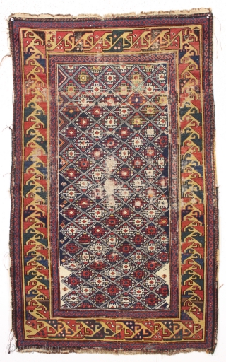 antique very small caucasian shirvan rug with an unusual design and a lovely yellow border. Very fine weave. Supple, cloth like handle. As found, with mostly even tight pile, some scattered wear  ...