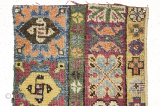 antique little mystery fragment. Attractive colors and interesting archaic spiral motifs. Probably a border fragment of a large carpet. My guess turkish or Moroccan. Neat little pile weaving.  17" x 37"
  ...