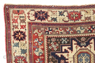 antique caucasian rug, probably kuba, with bold lesghi stars and the complex drawing that indicates good age. As found, mostly good pile elements on a very corroded brown ground. Some scattered damage  ...